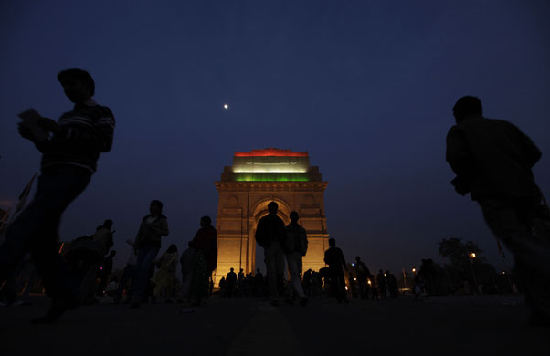 24 hours in pictures: New Delhi, India: People gather around the India Gate monument