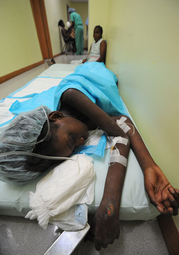 Haiti's survivors: 20 January: Eleven-year-old Mendji Bahina Sanon is watched by her mother