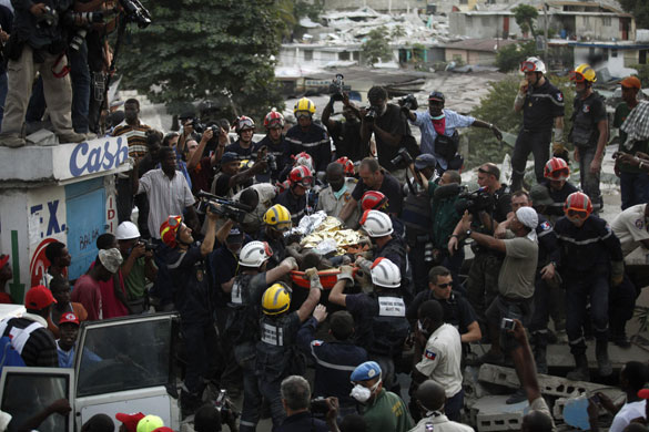 Haiti's survivors: 27 January: A Haitian girl is rescued by a French team