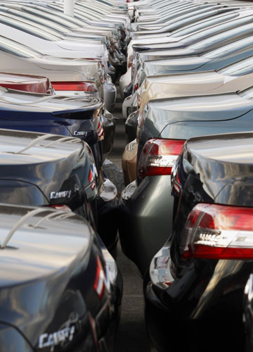 Week in business: Toyota Camrys at a dealership in Norwood, Massachusetts