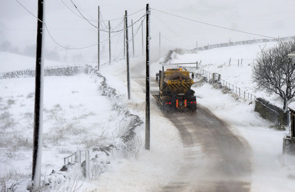 Week in business: A snowplough clears roads in the Huddersfield area 