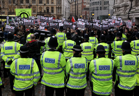 Anti-Blair protests: Police monitor demonstrators outside the Queen Elizabeth II Centre