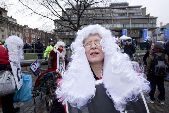 Anti-Blair protests: Demonstrators wearing judges' wigs outside the inquiry