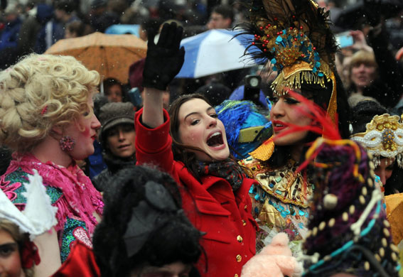 24 hours in pictures: Cambridge, US: Anne Hathaway rides in a car with Hasty Pudding Theatricals