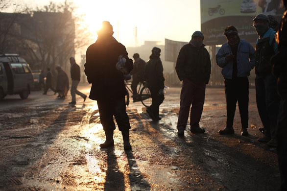 24 hours in pictures: Kabul, Afghanistan: Unemployed men gather on a street corner