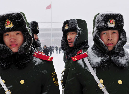 24 hours: Beijing, China: Paramilitary policemen stand guard at Tiananmen Square