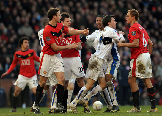 FA cup 3rd round: Jonny Howson, second right, front, confronts Manchester United's Wes Brown