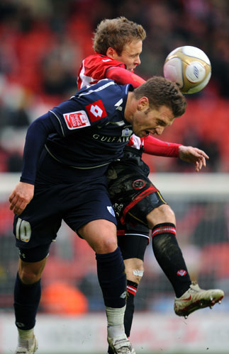 FA cup 3rd round: Sheffield United's Derek Geary and QPR's Akos Buzsaky compete for the ball