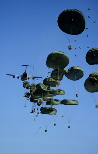 24 Hours in Pictures: Air Force C-17 Globemaster III aircraft airdrops aid into Port-au-Prince