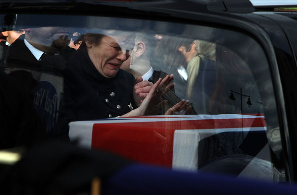 24 Hours in Pictures: The Bodies Of Two British Soldiers Killed In Afghanistan Are Repatriated