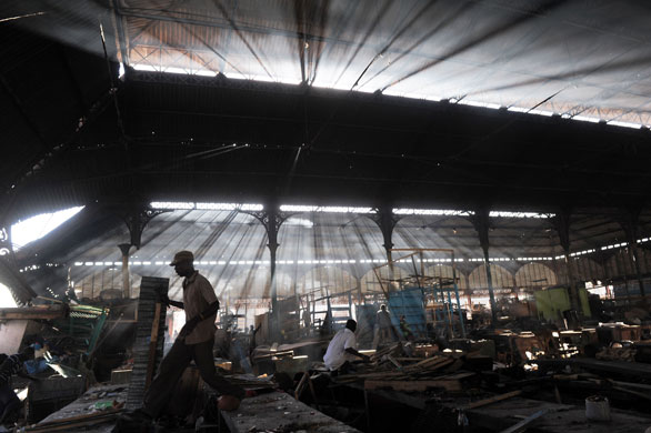 24 hours in pictures: Port-au-Prince, Haiti People look at  damage to iron market after a fire
