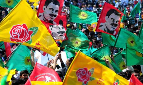 Kurds wave flags for the PKK and the Democratic Society Party (DTP) at a rally