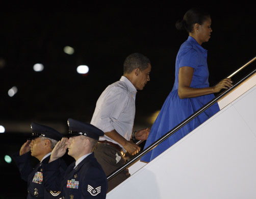 Obama in Hawaii: Barack Obama and first lady Michelle Obama board Air Force One
