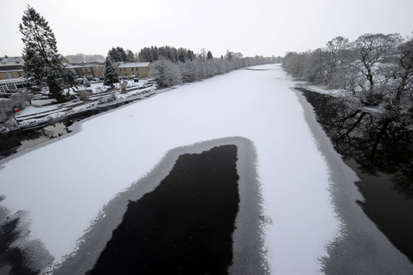 UK weather update: Chollerford: The River Tyne freezes over in Newcastle
