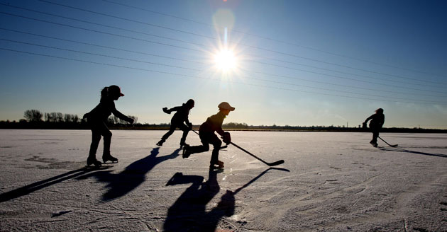 UK weather update: Members of the Peterborough Penguins Ice Hockey Club frozen Whittlesey Fen