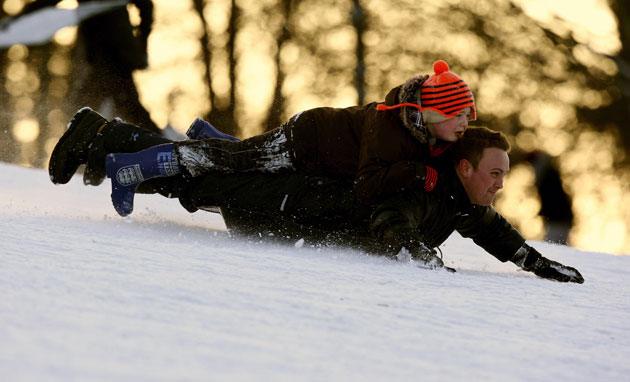 Winter weather: Nottingham: People sledging in Wollaton Park