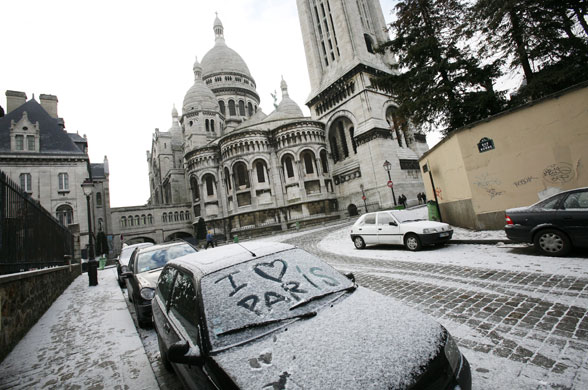 Northern hemisphere: Paris, France: The Sacre Coeur of Montmartre after a snow shower