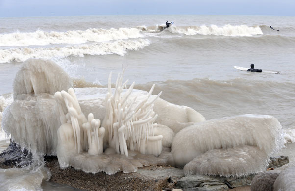 Northern hemisphere: Wisconsin, USA: Surfers in the 3-4 Celsius waters of Lake Michigan
