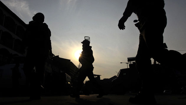 24 hours in pictures: Srinagar, India: Soldiers arrive at a gunbattle with insurgents in Kashmir