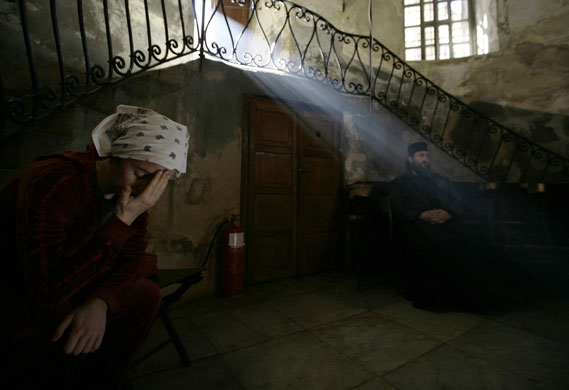 24 hours in pictures: A worshipper prays inside the Church of the Nativity in Bethlehem