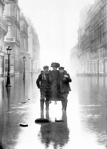 Paris flood: Two men carrying a woman