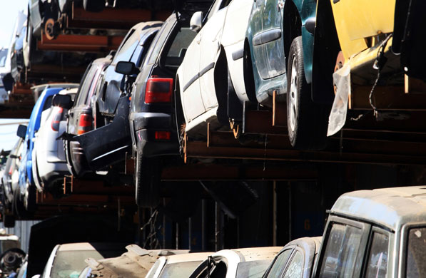 Week in business: Cars are stacked for dismantling and recycling at CMS Vehicle Solutions Ltd