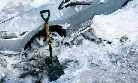 shovel by a car