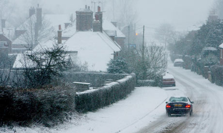 A driver eases through Great Chart in Kent, as snowy conditions continue across the country