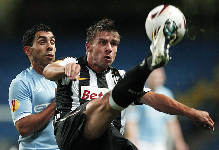 Europa League City: Juventus' Zdenek Grygera clears from Manchester City's Carlos Tevez
