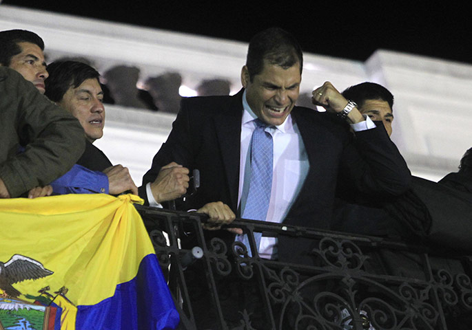 Ecuador Crisis Update: Ecuadorean President Rafael Correa speaks from the balcony of the Palace