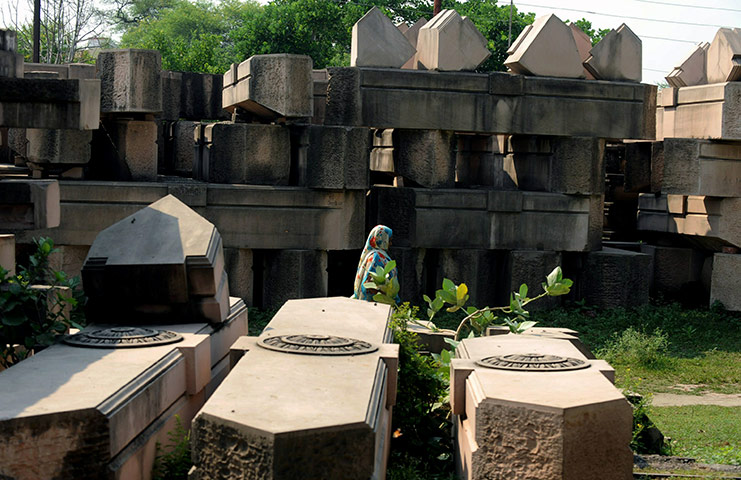 Ayodhya Update: An Indian woman walks past stone pillers for the proposed Rama temple