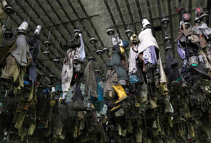 24 hours in pictures: Clothes of coal miners are seen at the mine at the RAG coal mine in Hamm