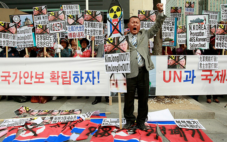 24 hours in pictures:  South Korean protestors shout slogans at a rally