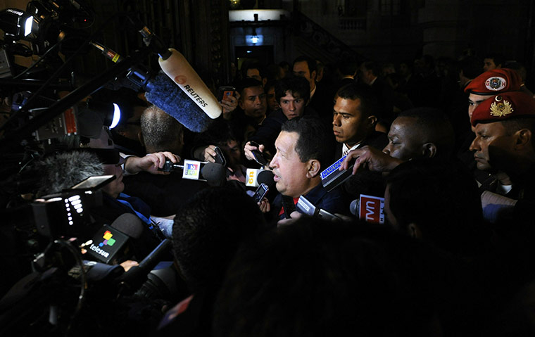 24 hours in pictures: Venezuelan President Hugo Chavez talks to press