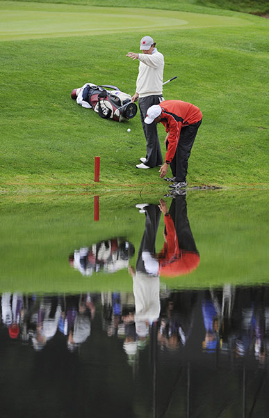 RYDER CUP DAY 1: Phil Mickelson drops his ball after putting his 2nd shot into the water