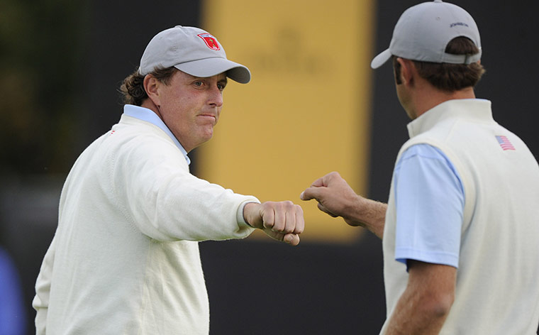 RYDER CUP DAY 1: Phil Mickelson and Dustin Johnson celebrate taking the 10th