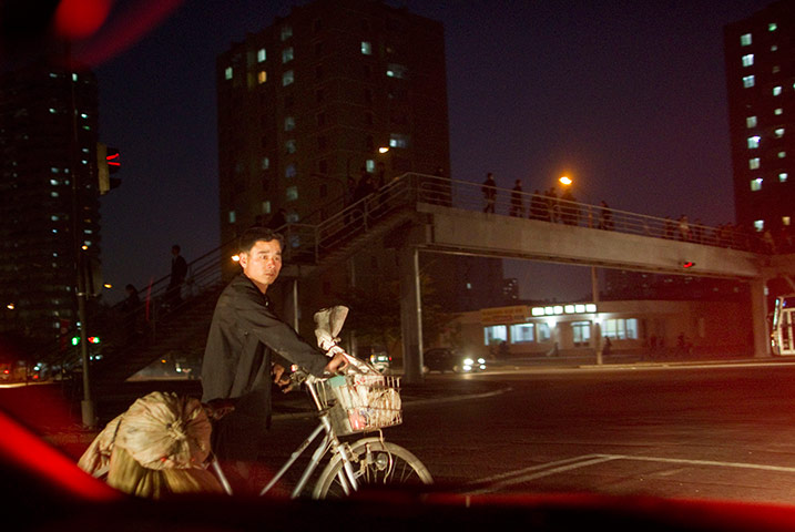 North Korea: Media are driven through the streets of Pyongyang in a non stop convoy