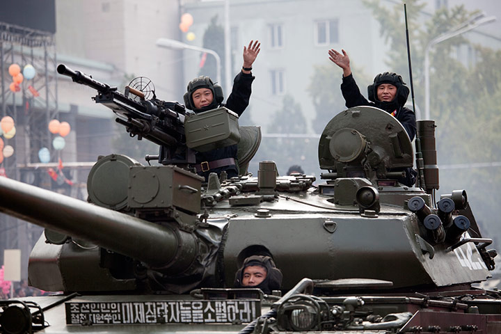 North Korea: North Korean tank crews wave to the crowds