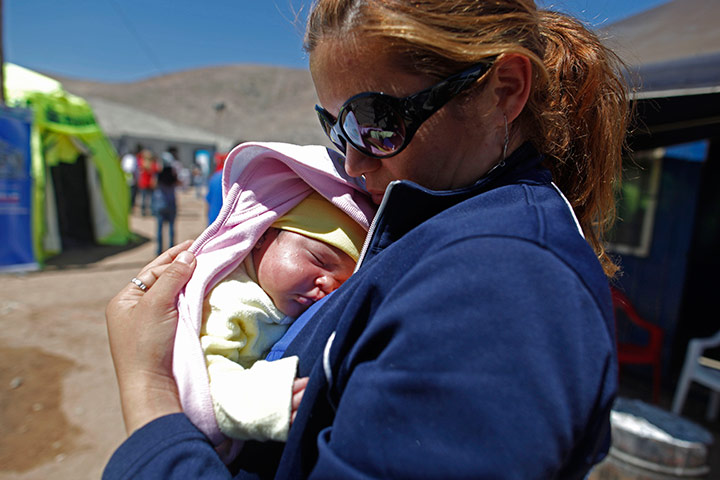 Chile miners: Elizabeth Segovia holds her daughter, the first baby of trapped miner