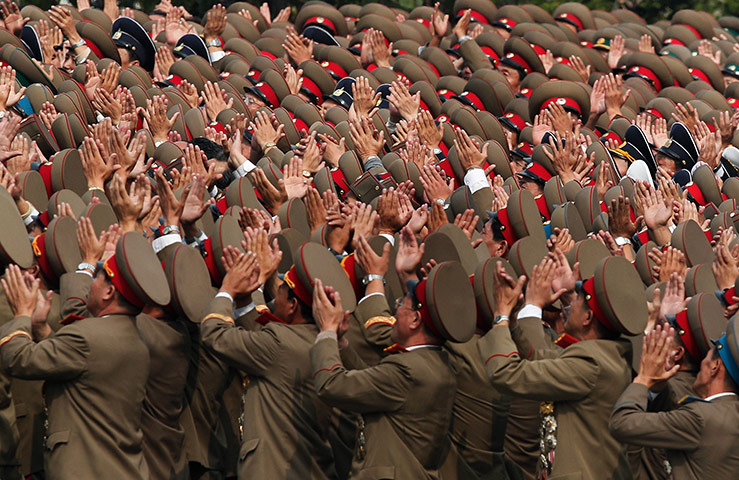 24 hours: North Korean soldiers applaud to their leader Kim Jong Il