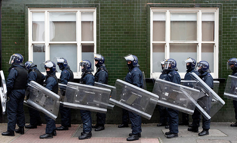 24 hours: Riot police wait to be deployed during a march by the EDL in Leicester