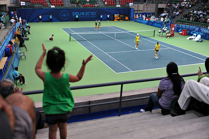 sport: An Indian girl claps while watching the