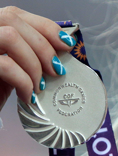 sport: Child holds her silver medal