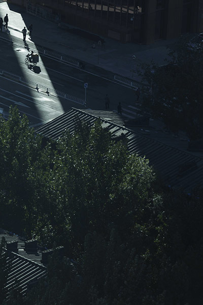 24 hours in pictures: Beijing, China: Commuters pass through a strip of sunlight