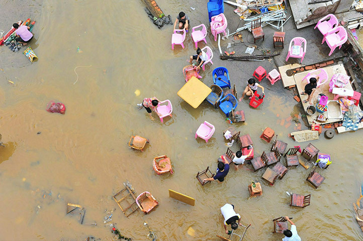 24 hours in pictures: Flood-Hit Hainan Hopes To Return To Normal Life
