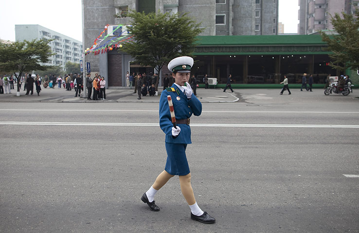 Dan Chung: A traffic lady directs traffic in Pyongyang