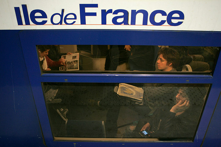 French Strikes: Commuters board a train at the Gare du Nord 