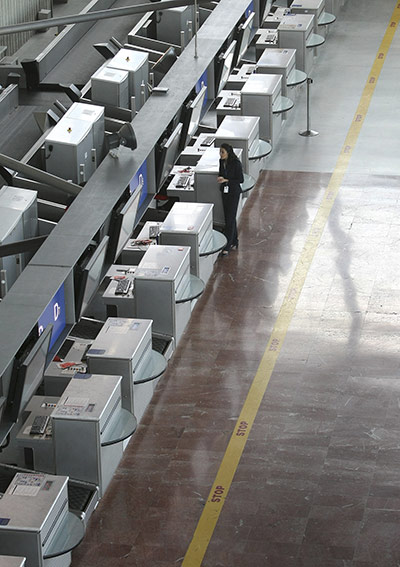 French Strikes: A Nice airport employee stands at check in desks