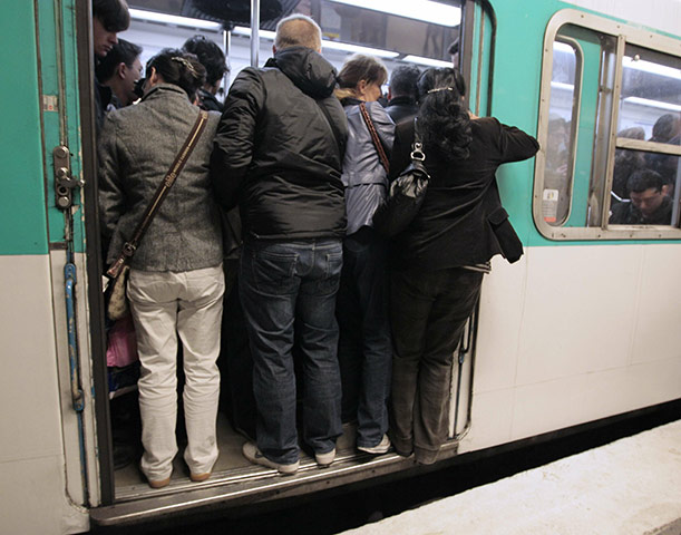 French Strikes: Commuters get in a train