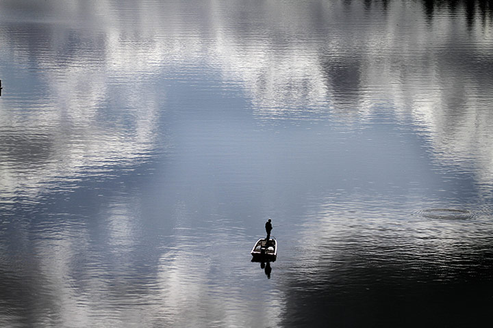 24 hours in pictures: Portland, USA: A lone fishermanon the Willamette River 